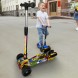 Детский трехколесный самокат с музыкой и дымом световые эффекты Voltronic Граффити Джокер (НКП)